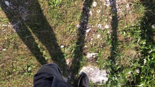 Cute twink boy enjoys the sunset in the mountains